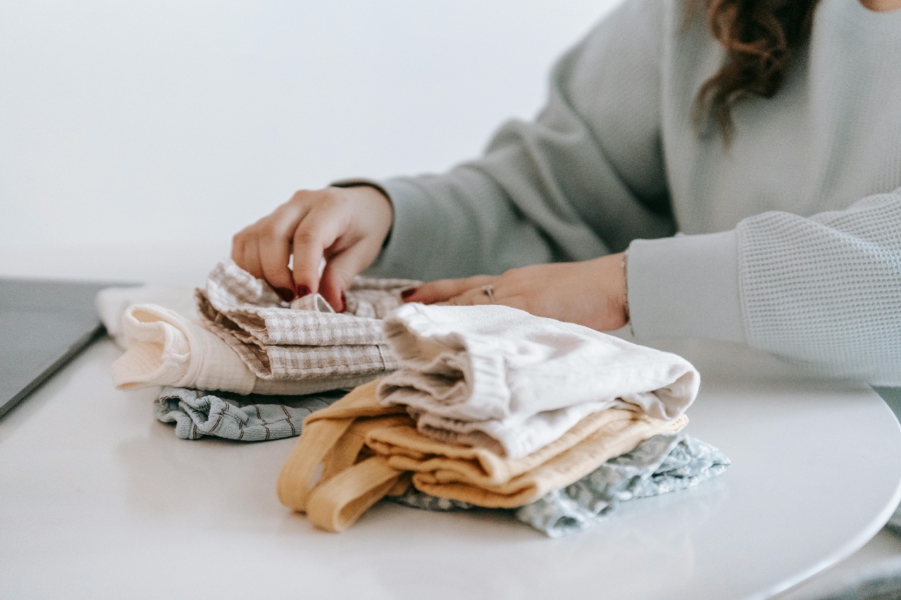 Sorting and folding clothes during organization