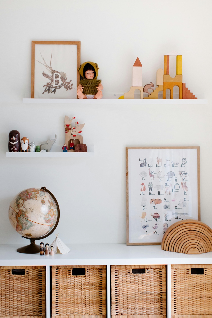 Playroom shelves with wicker baskets and styled decor